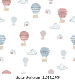 Cute seamless pattern with pastel hot air balloons and clouds. Vector hand drawn illustration. Can be used for nursery, scrapbooking, decoration party, wallpaper, fabric and much more.