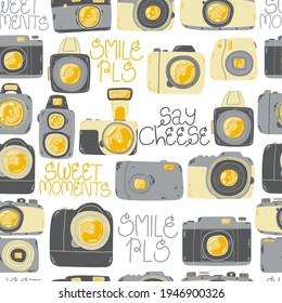 Cute seamless pattern with photo camera in cartoons style. Background with retro, dslr, instant and digital cameras in flat design. Vector endless background with cute hand drawn cameras. 
