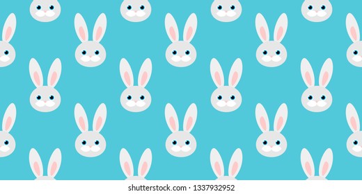 cute seamless pattern with rabbits on blue background. vector illustration.