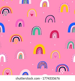 Cute seamless pattern with cute rainbow on pink background. Creative vector background for fabric, textile, nursery wallpaper.