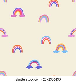 Cute seamless pattern with rainbows. Colorful wall paper for kids room or nursery. Girls fabric print design.