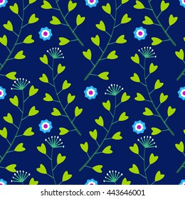 Cute seamless pattern with small blue flowers and green grass on a dark background.Leaves heart-shaped.Bright summer patterns.Vector illustration for fabric,textile,scrapbooking,wrapping paper.
