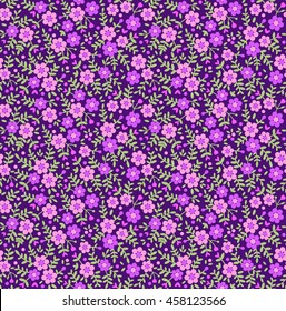 Cute seamless pattern in small flower. Small purple flowers. Dark violet background. Ditsy floral background. The elegant the template for fashion prints.