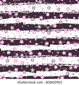 Cute seamless pattern with a small flower in a vintage style. Bright bouquets on a fashion grunge background. Blossoming background for printing on fabric, wallpaper and paper. Vector