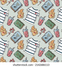 cute seamless pattern with T-shirts and books on green background. vector hand drawn art
