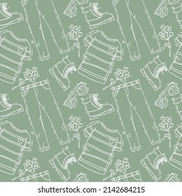 cute seamless pattern with T-shirts and jeans on green background. vector hand drawn shoping art
