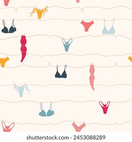 Cute seamless pattern with underwear hanging on a string. Swimsuit, bikini, panties, bra in summer day. Summer time vacation and travel aesthetic. Groovy and fun vector tropical background