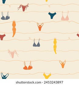 Cute seamless pattern with underwear hanging on a string. Swimsuit, bikini, panties, bra in summer day. Summer time vacation and travel aesthetic. Groovy and fun vector tropical background