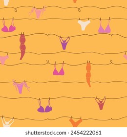 Cute seamless pattern with underwear hanging on a string. Swimsuit, bikini, panties, bra in summer day. Summer time vacation and travel aesthetic. Groovy and fun vector tropical background