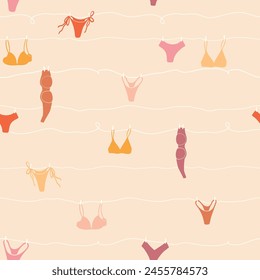 Cute seamless pattern with underwear hanging on a string. Swimsuit, bikini, panties, bra in summer day. Summer time vacation and travel aesthetic. Groovy and fun vector tropical background