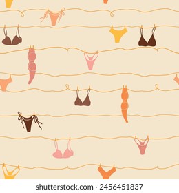 Cute seamless pattern with underwear hanging on a string. Swimsuit, bikini, panties, bra in summer day. Summer time vacation and travel aesthetic. Groovy and fun vector tropical background