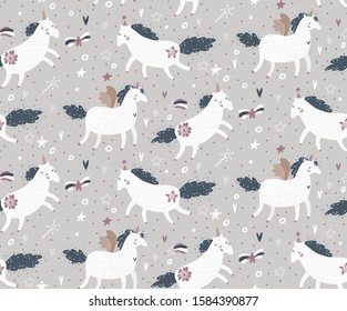 Cute seamless pattern with unicorns, stars, and hearts. It can be used for baby t-shirt print, fashion print design, kids wear, baby celebration, fabric, and wrapping.