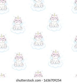 Cute seamless pattern with white cat in a unicorn costume with wings and rainbow horn. It can be used for packaging, wrapping paper, textile and etc.