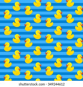 Cute seamless pattern with yellow rubber duck on blue background. Can be used for wallpaper, pattern fills, web page background, surface textures