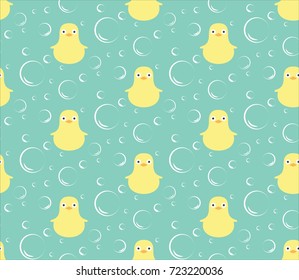 Cute seamless pattern with yellow rubber duck on blue background. Duck toy baby shower illustration.