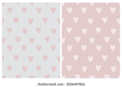 Cute Seamless Vector Pattern with Pink Irregular Hand Drawn Hearts on a Light Pink and Light Gray Background. Funny Infantile Design with Love Symbols. Romantic Repeatable Print ideal for Fabric.