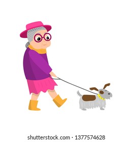 Cute senior woman with pink hat walking with dog