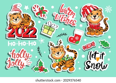Cute set with cartoon baby tigers in a santa claus hat. Vector illustration isolated. T-shirt design. Concept christmas, chinese new year, symbol of 2022. Fashion patch badges