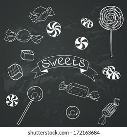 Cute set of hand drawn doodle sweets on chalkboard background. Cartoon candy collection.
