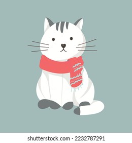 Cute sitting cat in a winter knitted scarf.