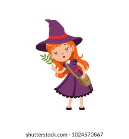 Cute small red-haired girl witch in purple dress, hat, with cross body bag. Smiling kid character in costume studying herbs. Vector flat cartoon illustration on white