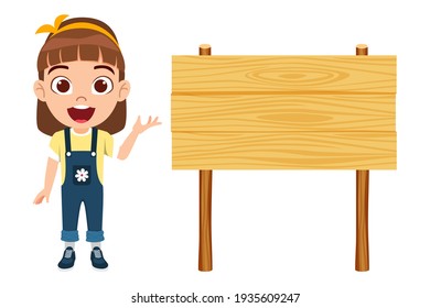 Cute smart kid girl character wearing beautiful yellow outfit and pointing to blank wooden board with cheerful facial expressions