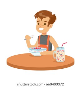 Cute smiling boy having breakfast in the kitchen, colorful character vector Illustration