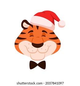 Cute smiling cartoon tiger head isolated on white background. Flat happy character face in Santa hat. Chinese New Year adorable symbol. Comic striped wildcat portrait. Christmas vector illustration.