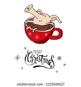 Cute smiling doodle piggy in a hot cacao on winter holidays. Symbol of 2019 year. Merry Christmas. Christmas calligraphy. Hand written modern brush lettering. Hand drawn design elements. Festive card.