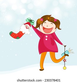 Cute smiling girl holding firecracker and Christmas stocking for Merry Christmas and other occasion celebration.