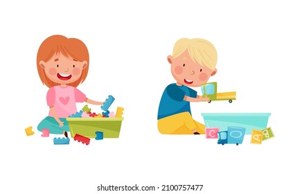 Cute smiling little boy and girl sitting on floor and playing with toys cartoon vector illustration