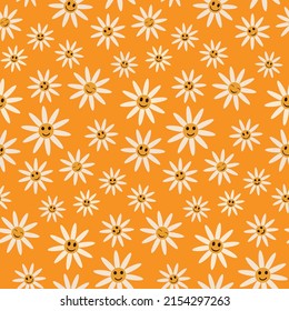 Cute smiling white daisy flowers seamless pattern on orange background in retro  70s style. For textile, baby shower and gift wrapping paper 