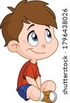 Cute smiling young boy sitting on the floor
