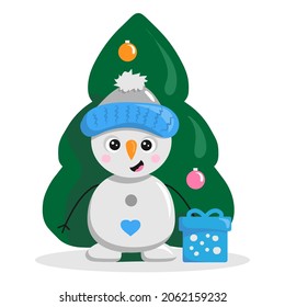 A cute snowman in a hat stands with a gift at the Christmas tree.