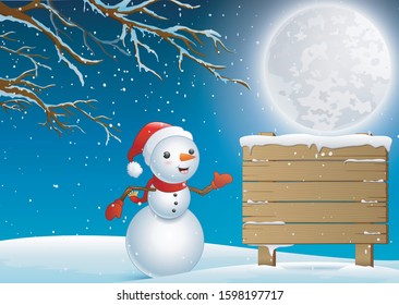 A cute snowman and wooden sign at winter night