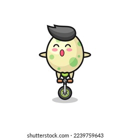 The cute spotted egg character is riding a circus bike , cute style design for t shirt, sticker, logo element