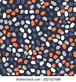 cute spotted seamless pattern. gray, coral, white various small spots are randomly located on a dark blue background. vector