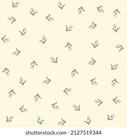 Cute spring seamless ditsy print for fabric with tiny blue tulips isolated on whitewashed yellow background. Vector illustration.