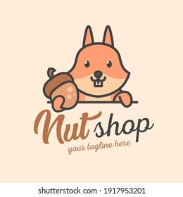 A cute squirrel holds a nut. Nut shop logo or mascot. Cute wild animal. 