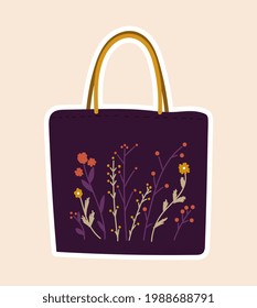 Cute sticker of purple bag sewed with flowers on cloth on pink background. Concept of sewing or needlework stickers with fabric, yarns, dress, accessories. Flat cartoon vector illustration