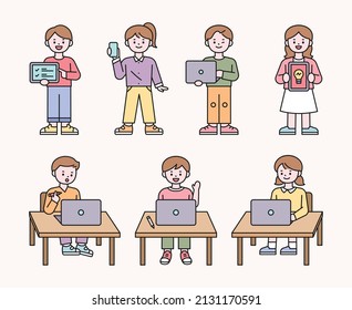 Cute students are sitting in the classroom and teaching online lessons on laptops. flat design style vector illustration.