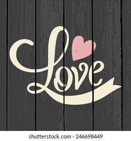Cute and stylish typographic design for Valentine's Day on a gray wood background.