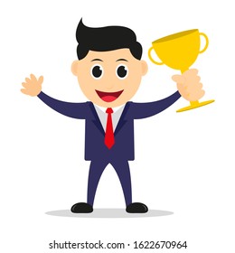 Cute successful business man standing happily holding a trophy.