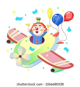 Cute sweet funny clown holds two yellow flags in his hands. Sits in colored airplane with red yellow blue inflatable balls. Candy holiday, fun games, focus, magic, children, childhood, circus.