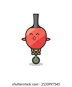 The cute table tennis racket character is riding a circus bike , cute style design for t shirt, sticker, logo element