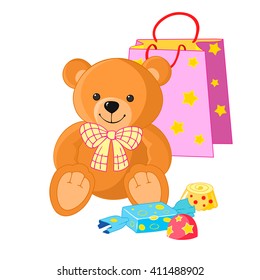 Cute Teddy bear with  gift bag and candy. Gift for  child's birthday