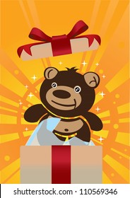 Cute teddy bear inside a gift box.