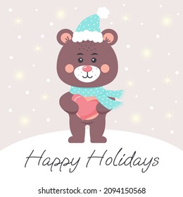 Cute teddy bear in a scarf and hat holding a heart. Happy Holidays lettering. Greeting card.