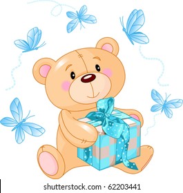 Cute Teddy Bear sitting with blue gift box