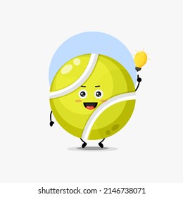 Cute tennis ball character with light bulb idea